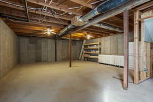 Basement featuring ceiling fan