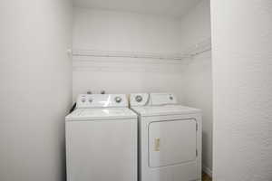 Laundry area featuring independent washer and dryer