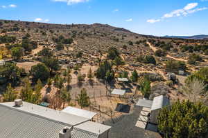 Birds eye view of property with a mountain view