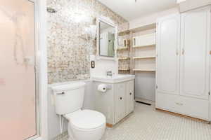 Bathroom featuring vanity and toilet