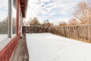 View of yard layered in snow