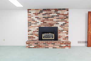 Interior details with carpet floors and a fireplace