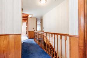 Hallway with carpet floors