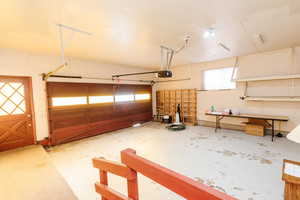 Garage featuring a garage door opener