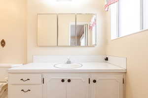 Bathroom with vanity and toilet