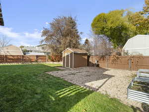 View of yard with a storage shed