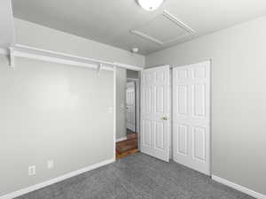 Unfurnished bedroom with carpet floors