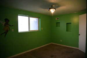 Unfurnished room with carpet flooring