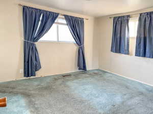 View of carpeted spare room