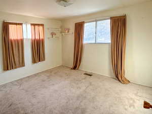 Empty room featuring carpet