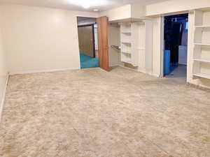 Unfurnished bedroom featuring carpet and a textured ceiling