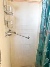 Bathroom with a shower with curtain