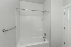 Bathroom with shower / washtub combination