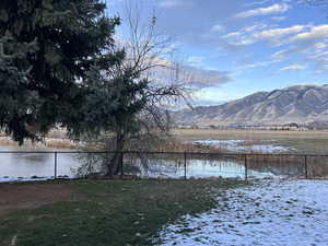 View from the patio featuring a waterfront view