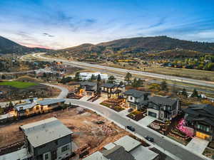 Aerial view at dusk featuring a mountain view