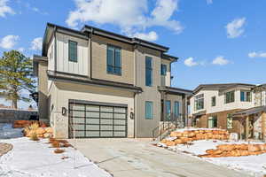 View of front of property featuring a garage