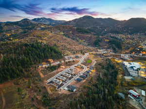 Aerial view at dusk featuring a mountain view