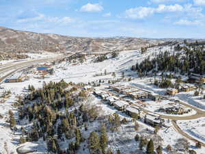 Snowy aerial view featuring a mountain view