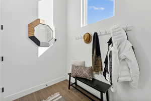 Mudroom with hardwood / wood-style flooring