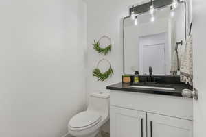 Bathroom featuring vanity and toilet