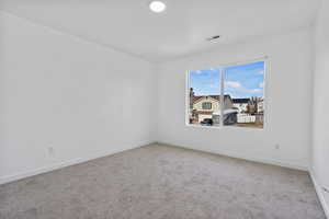 View of carpeted spare room