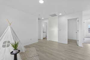 Unfurnished room featuring light wood-type flooring