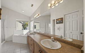 Bathroom with plus walk in shower, tile patterned floors, a textured ceiling, vaulted ceiling, and vanity