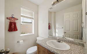 Bathroom with vanity and toilet