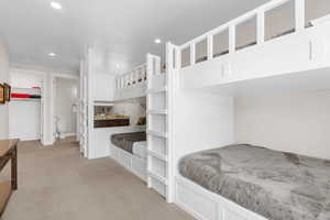 Carpeted bedroom with ensuite bath