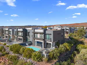 Rear view of house featuring a mountain view