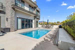 View of swimming pool with a patio