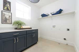 Laundry area featuring cabinets, hookup for a washing machine, gas dryer hookup, and electric dryer hookup