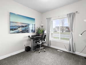 View of carpeted home office