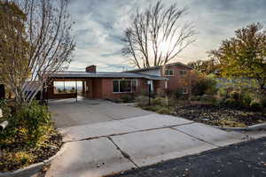 View of front of house featuring a carport