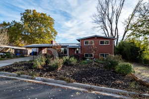 View of front facade with a carport