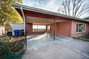 View of patio / terrace with a carport