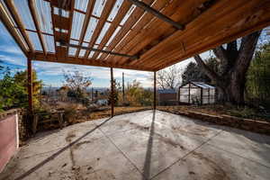 View of patio featuring an outdoor structure