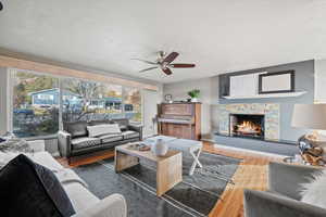 Living room featuring hardwood / wood-style flooring and ceiling fan