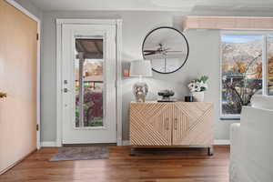 Foyer entrance featuring hardwood / wood-style floors, plenty of natural light, and ceiling fan