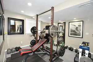 Exercise area with a textured ceiling