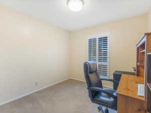 Office featuring light colored carpet