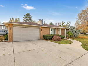 Single story home featuring a garage