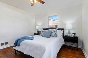 Bedroom featuring ceiling fan and dark hardwood / wood  flooring