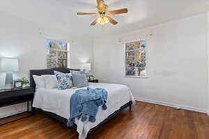 Bedroom featuring dark hardwood / wood floors and ceiling fan