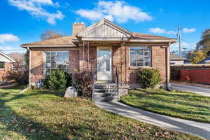 Bungalow-style home featuring a front yard