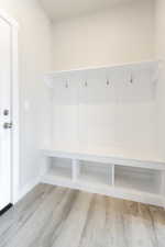 Mudroom with light hardwood / wood-style flooring