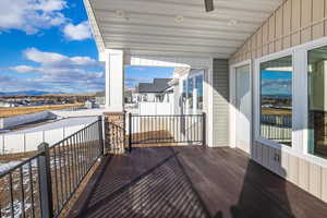 Balcony featuring ceiling fan