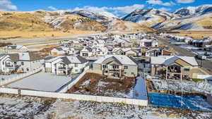 Snowy aerial view with a mountain view