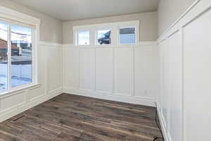 Spare room featuring dark hardwood / wood-style flooring