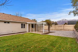 View of yard featuring a mountain view and a patio